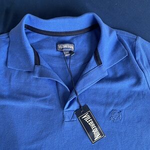 NWT Nice small adult or 14 year-old shirt never worn.